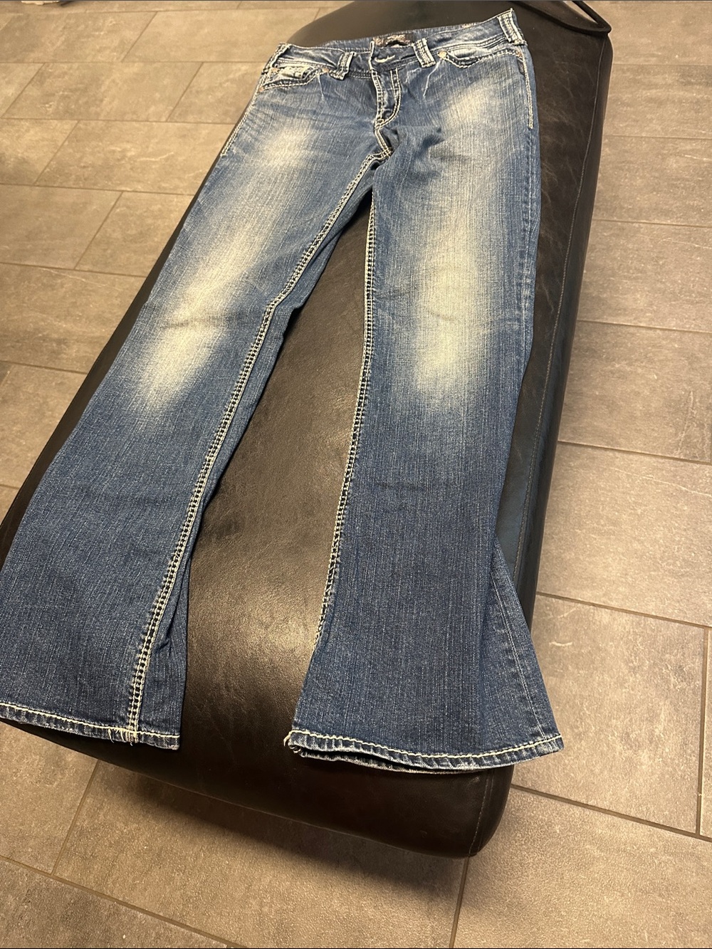 Silver Jeans Women's Medium Blue Flare Jeans with Faded Detailing